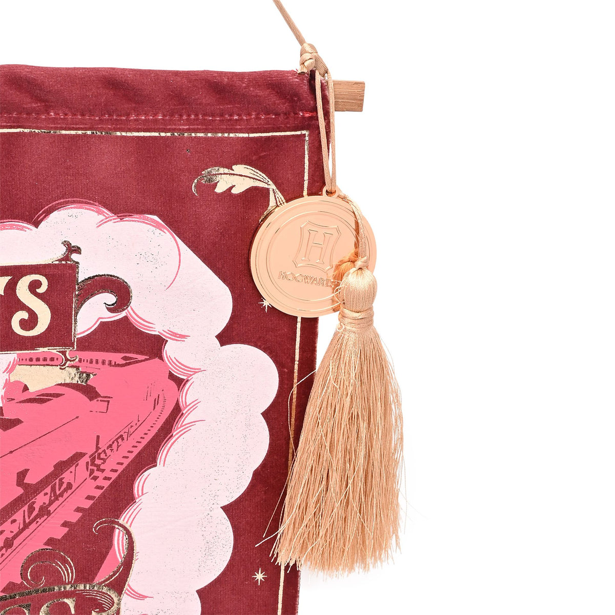 Maroon banner detail with Hogwarts crest medallion and gold tassel