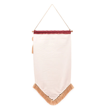 White fabric hanging banner with gold fringe trim and top hanging loop
