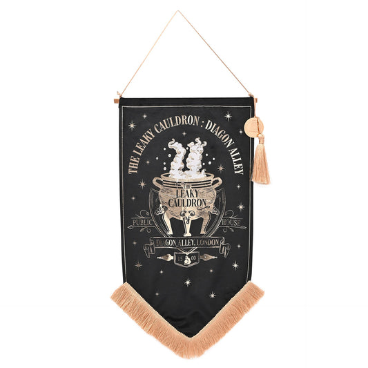 Black hanging banner with gold cauldron emblem, starry text, tan fringe bottom