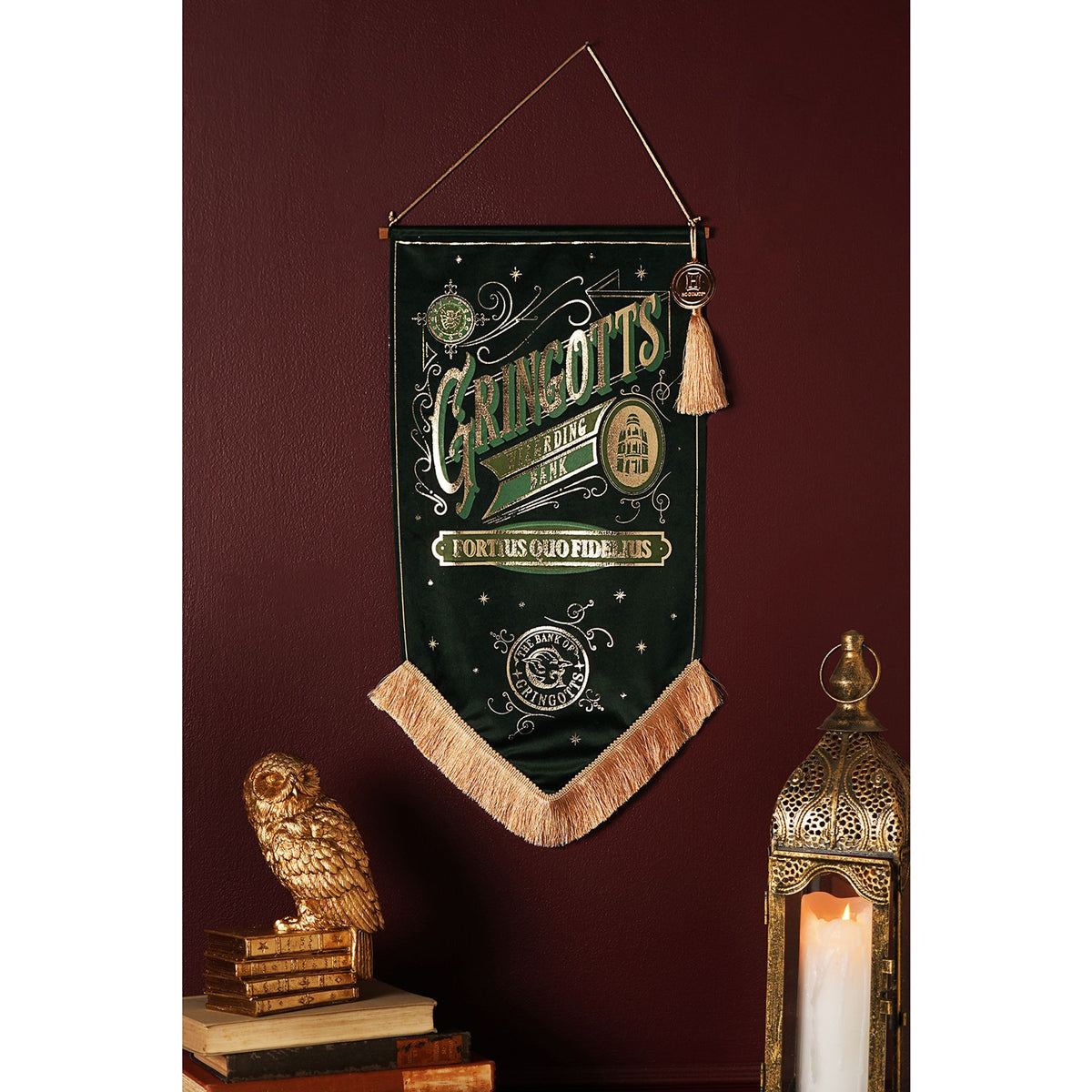 Green Hogwarts-style banner pennant with gold Gringotts text and tassel fringe