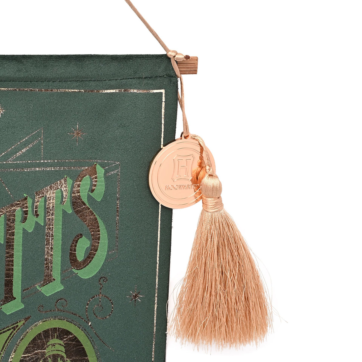 Green banner edge with tan tassel and circular emblem charm detail