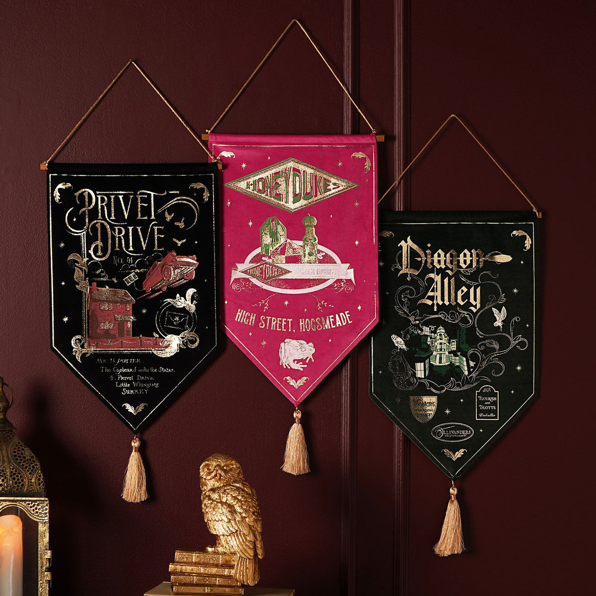 Three hanging Harry Potter house banners, Diagon Alley and two others, each with tassels