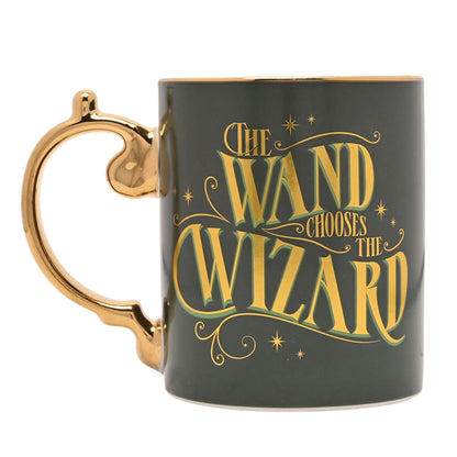 Dark green mug with gold “The wand chooses the wizard” text and gold handle