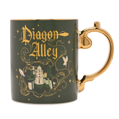 Dark green ceramic mug with gold handle and Diagon Alley logo with wand icon