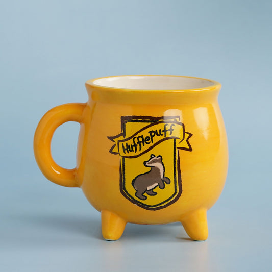 Yellow Hufflepuff cauldron-style mug with house crest and three legs