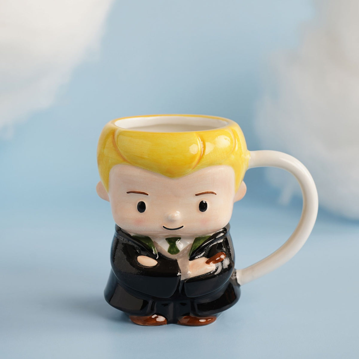 3D character mug with blonde boy in dark robes, white handle