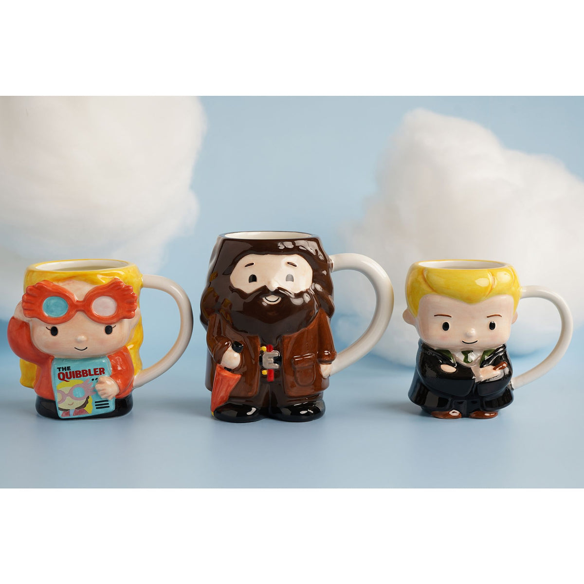 Set of three 3D character mugs: red-robed boy, bearded wizard, blonde student