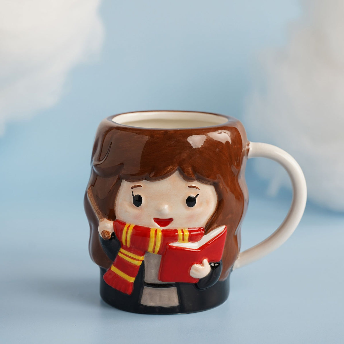Hermione 3D character mug with brown hair, red scarf, holding a red book