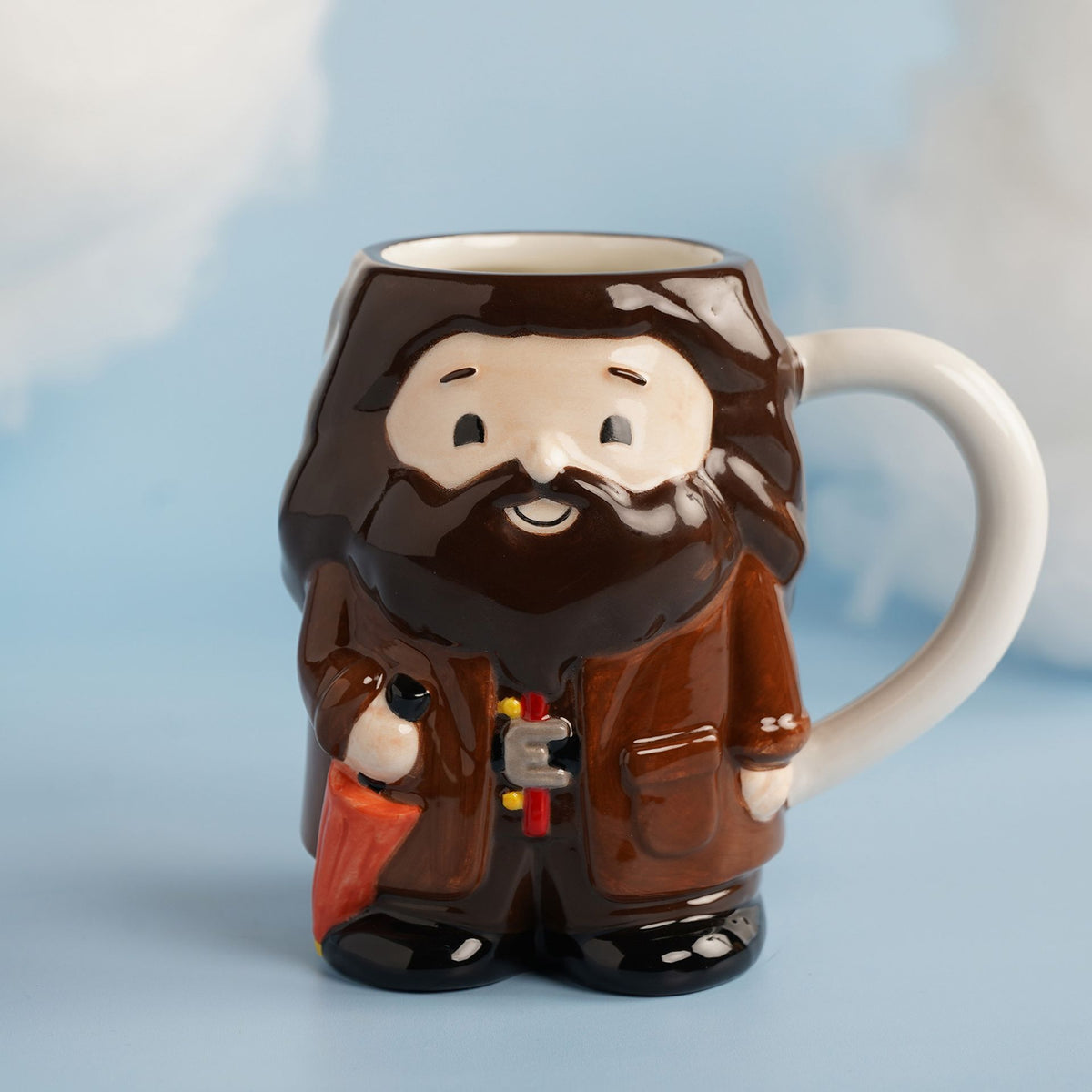 Brown 3D Hagrid character mug with painted face, beard, and red/gray belt details.