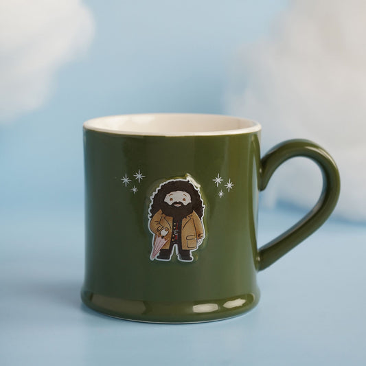 Dark green ceramic mug with bearded wizard graphic and small star accents