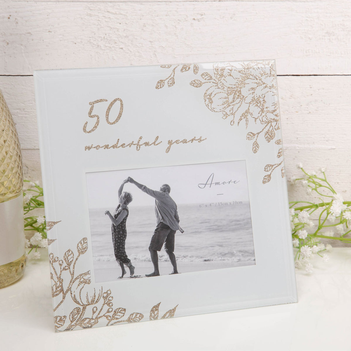 Gold floral glass photo frame with “50 wonderful years” text and centered portrait