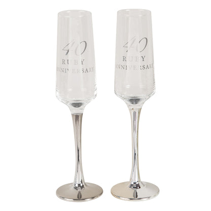 Two clear straight-stem champagne flutes engraved "40 Ruby Anniversary"