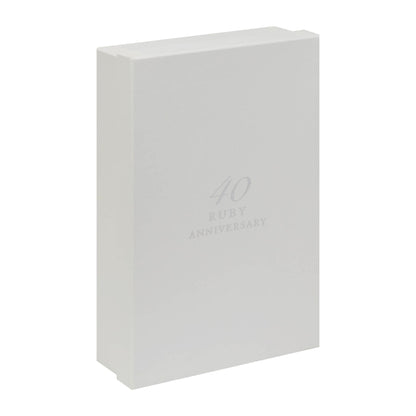 White presentation box with faint "40 Ruby Anniversary" logo on the front