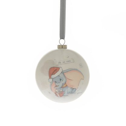 Round Christmas bauble with a blue rabbit character illustration and winter snowflake accents