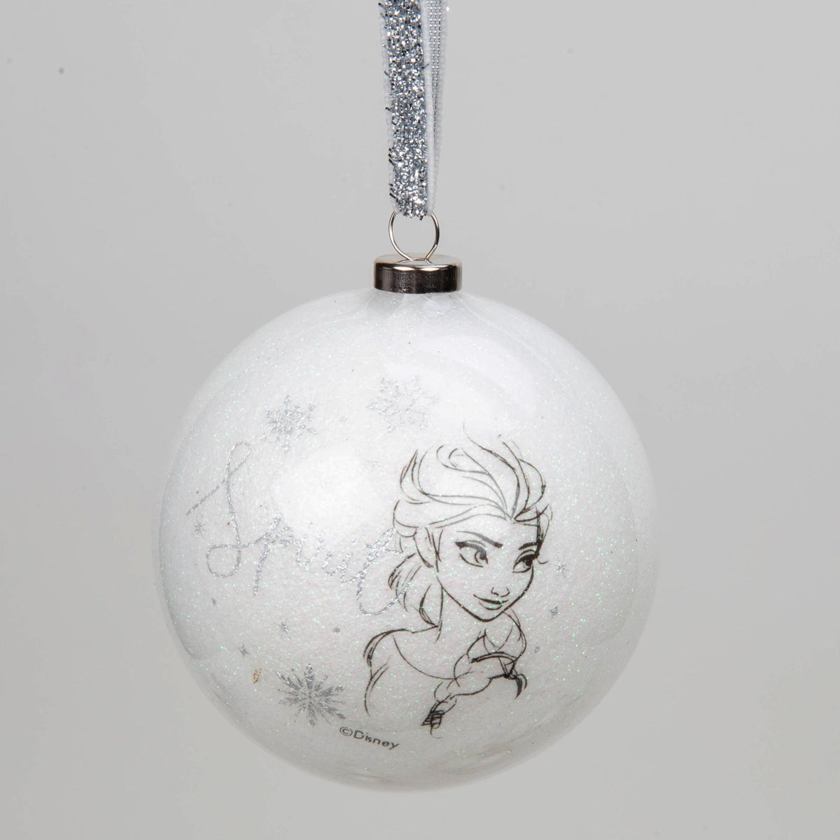 White acrylic glitter bauble with Anna portrait line art, hanging with silver ribbon