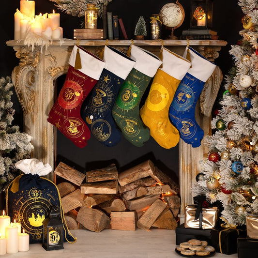Assorted Hogwarts-themed holiday stockings hanging on mantel, including yellow Hufflepuff