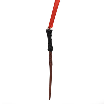 Resin wand tree decoration with red hanging ribbon, brown handle and dark tip