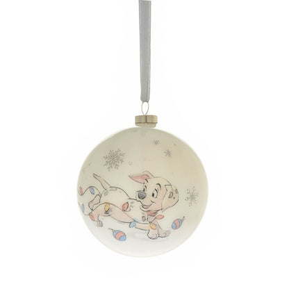 Round Christmas bauble with a smiling puppy-and-kitten cartoon, hanging by ribbon