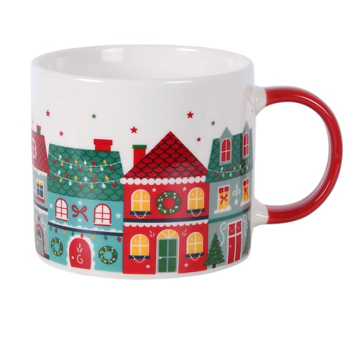White ceramic Christmas town print mug with red handle and star accents