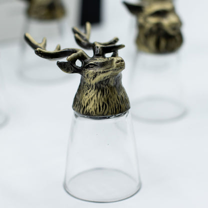 Antique bronze stag-head bottom-up shot glass with clear glass base
