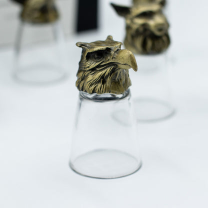 Antique bronze cat-like creature bottom-up shot glass, clear glass cup