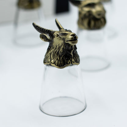 Antique bronze unicorn-head bottom-up shot glass with clear glass body