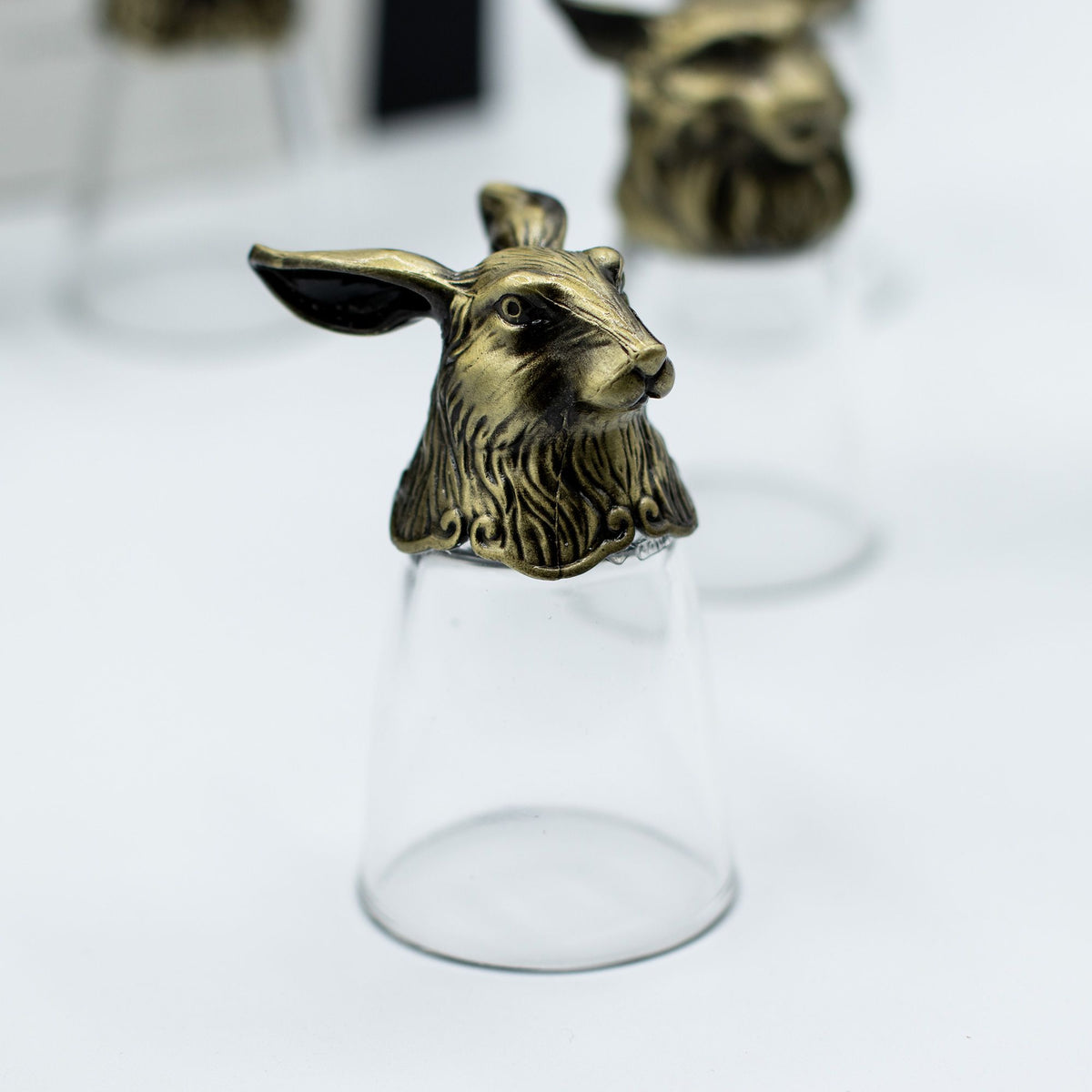 Antique bronze deer-head bottom-up shot glass with clear glass cup