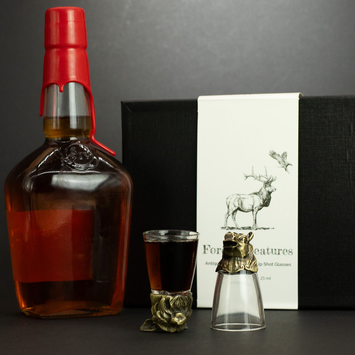 Forest-themed shot glass with antique bronze creature topper and clear base