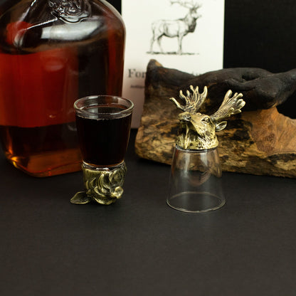 Antique bronze animal bottom-up shot glasses with filled glass shots