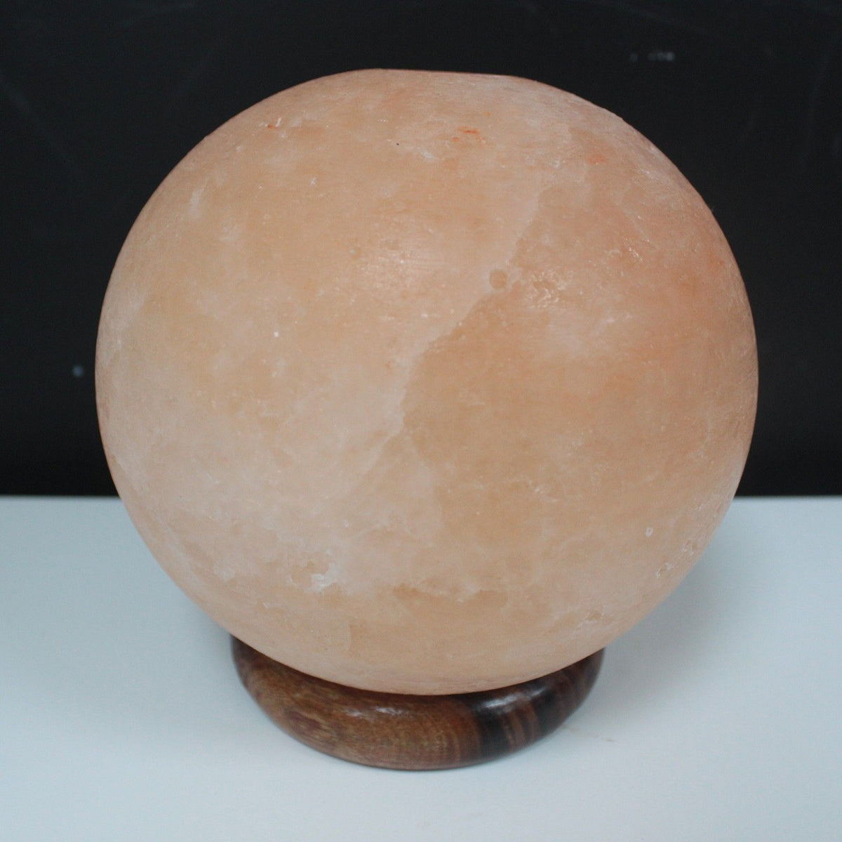 Himalayan Salt Lamp Ball On A Big Wooden Base