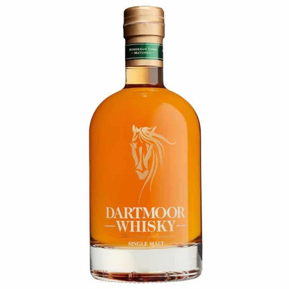 Single malt whisky bottle with amber liquid, gold cap, and Dartmoor Whisky label on front.
