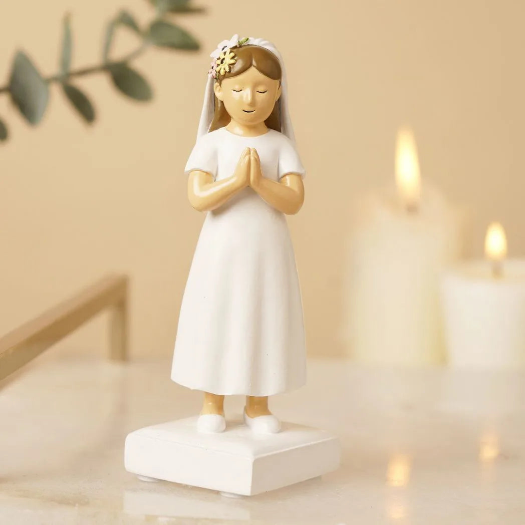 Communion girl figurine with white gown and floral headpiece, hands together in prayer