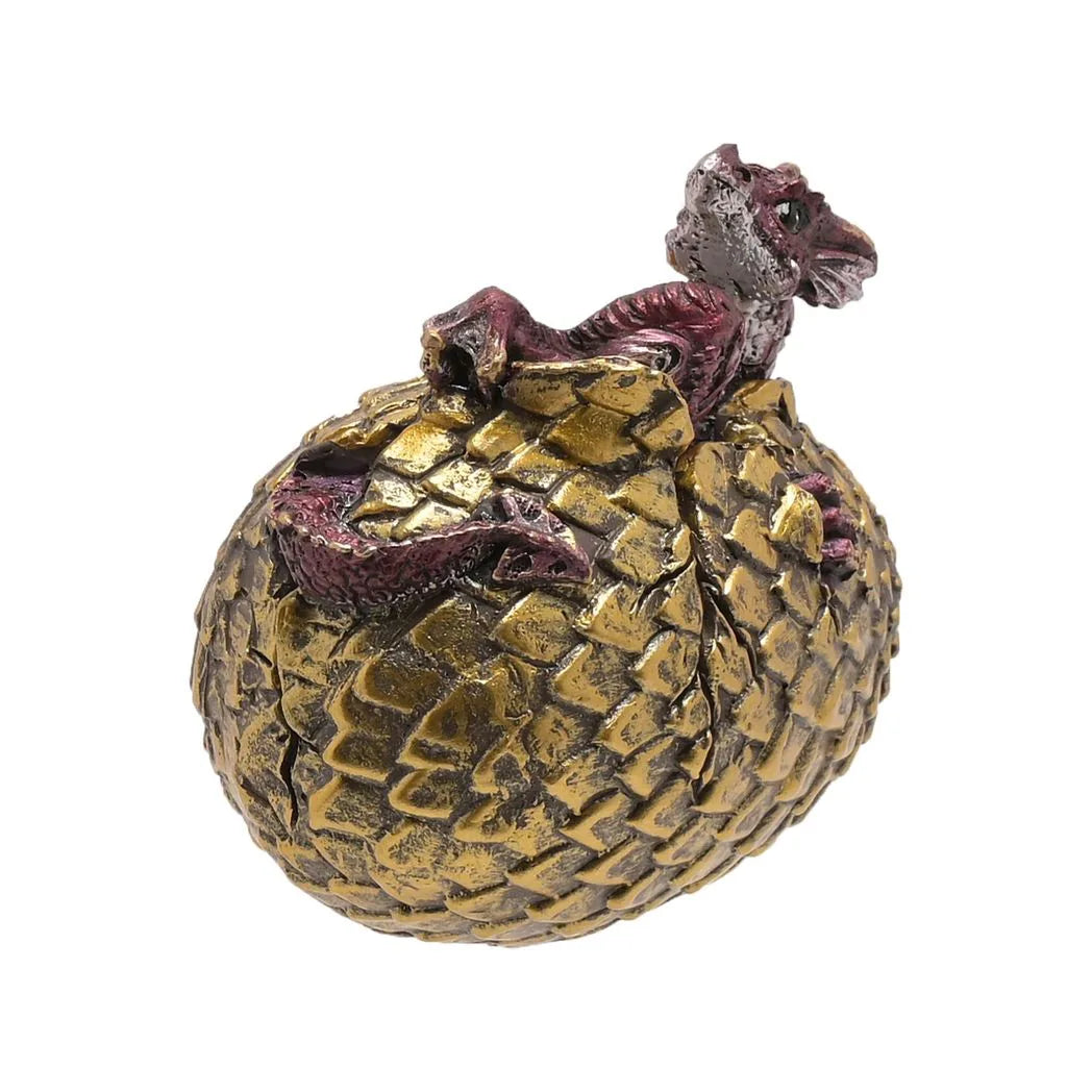 Golden dragon egg figurine with gray and purple dragon hatchling emerging