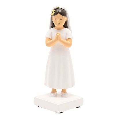Communion girl figurine in white dress with veil and floral headpiece, hands in prayer