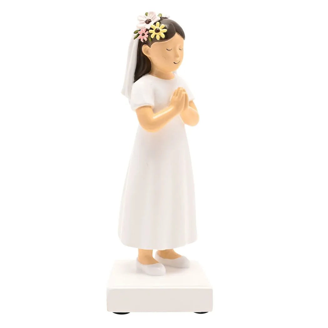 Communion girl figurine in white dress, veil draped over hair, prayer gesture, on base