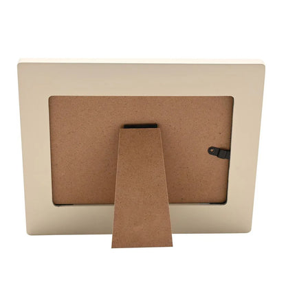 Photo frame back with cardboard backing and fold-out stand