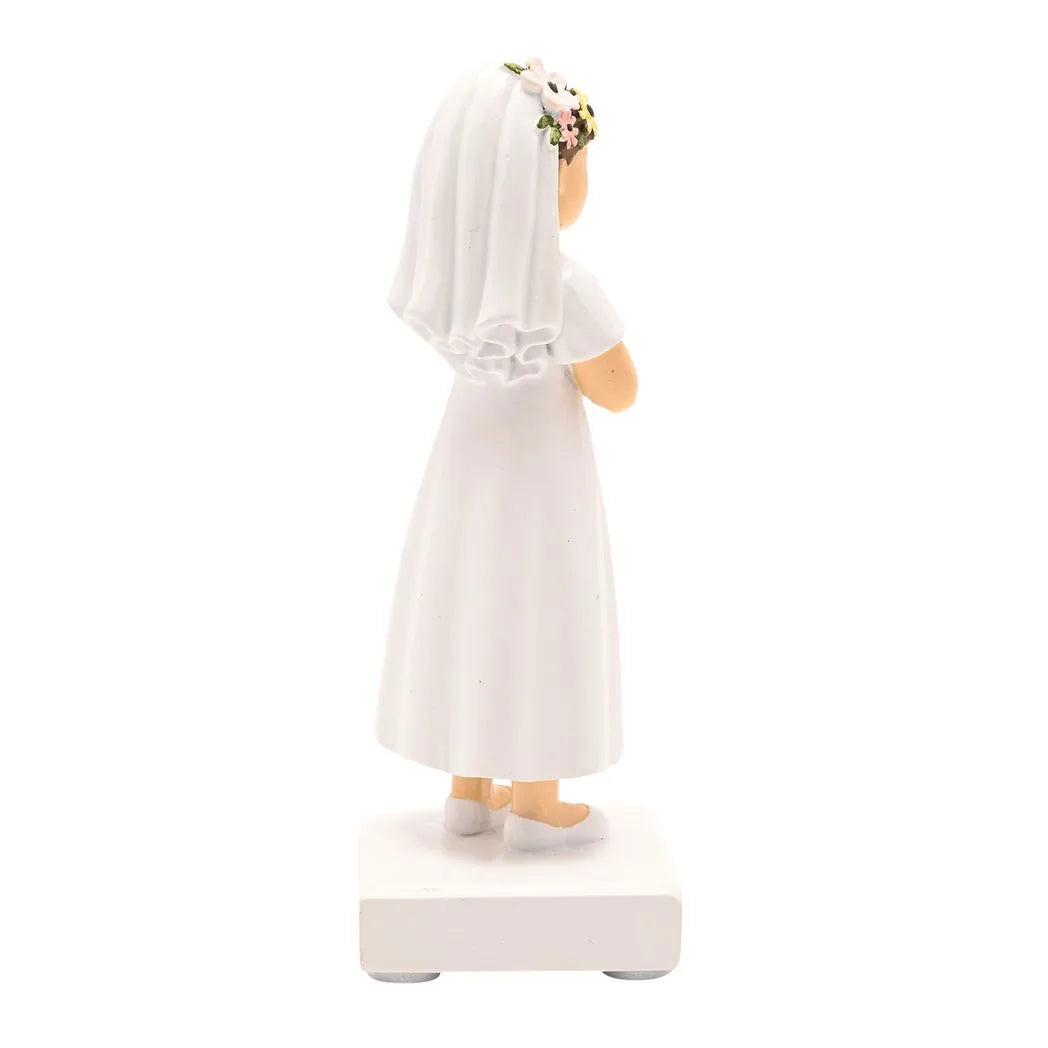 Rear three-quarter view communion girl figurine, white dress with lace trim, floral hairpiece