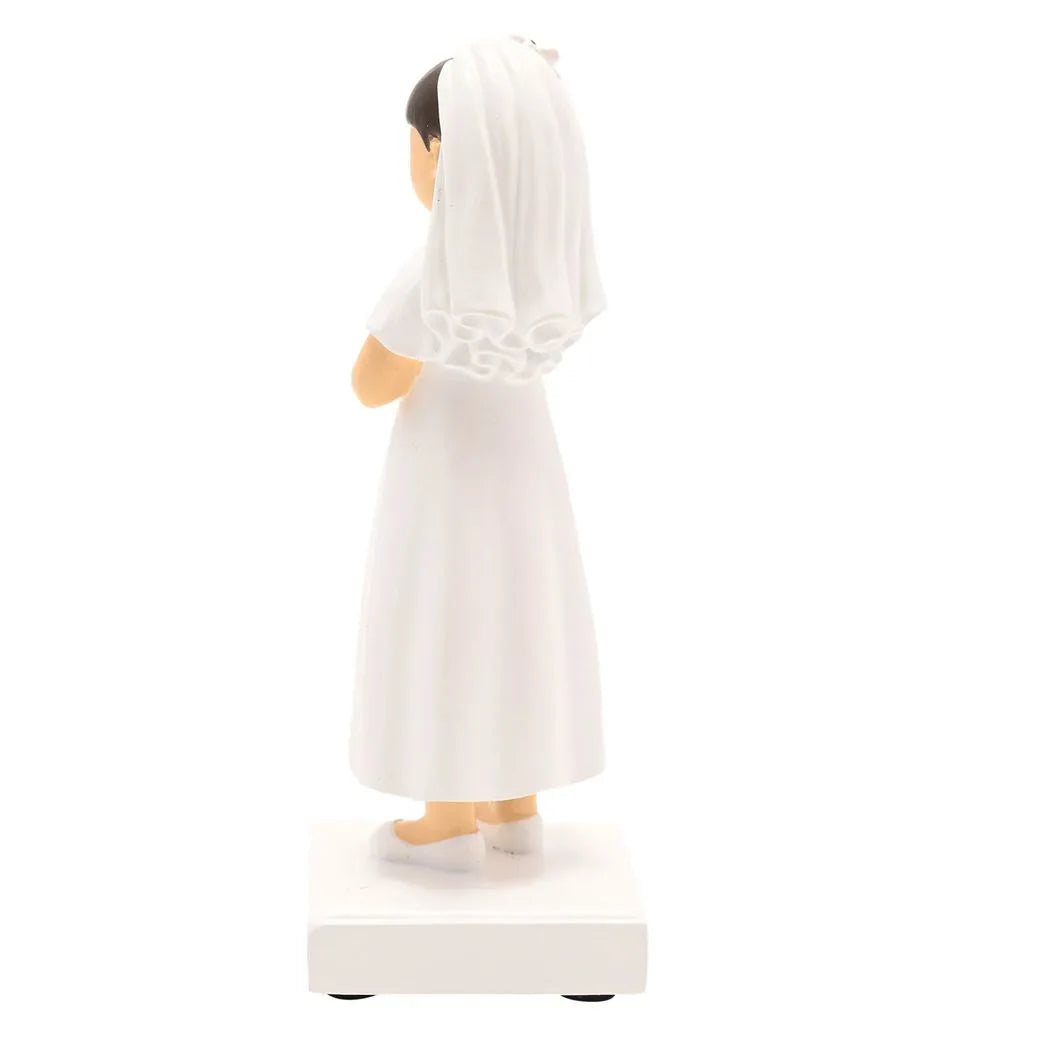 Rear view communion girl figurine with veil, white dress, hands together, on base