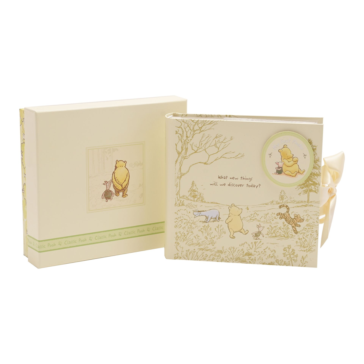 Winnie the Pooh heritage photo album box with woodland cover art and ribbon tie.