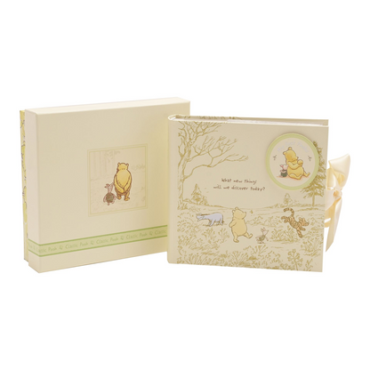 Winnie the Pooh heritage photo album box with woodland cover art and ribbon tie.