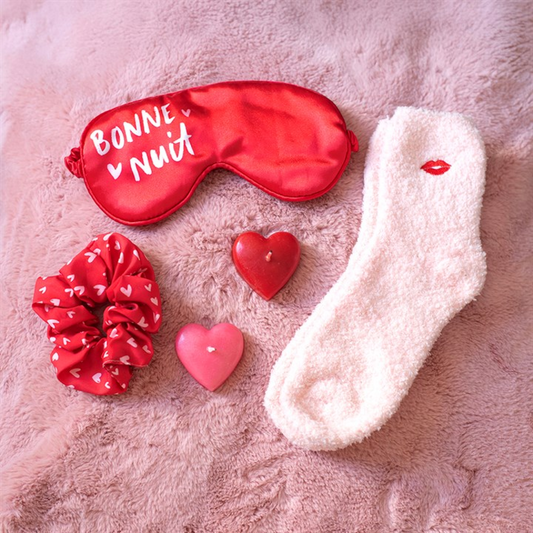Pamper gift set with red sleep mask, pink socks, red heart scrunchie and heart accents