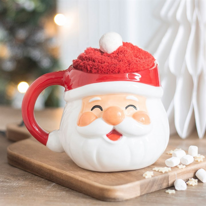 Santa face ceramic Christmas mug with red handle and fuzzy red hat topper