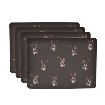 Set of four dark placemats with gold-and-white stag head pattern, stacked.