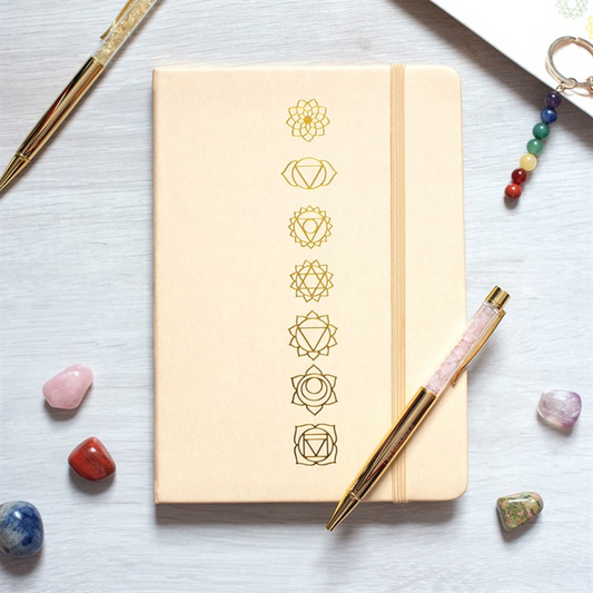 A5 notebook with gold chakra symbol cover and beige spine