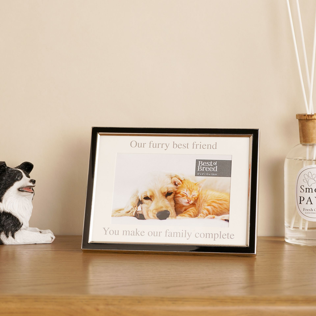 Black pet photo frame with 'Our furry best friend' and 'You make our family complete' text