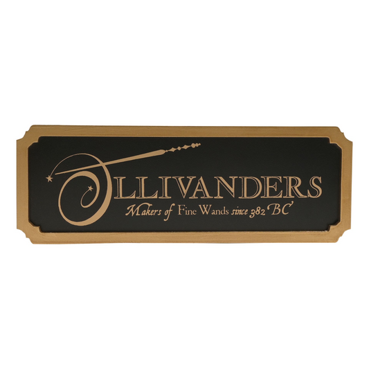 Ollivanders vintage-style wall sign with black panel and gold logo lettering