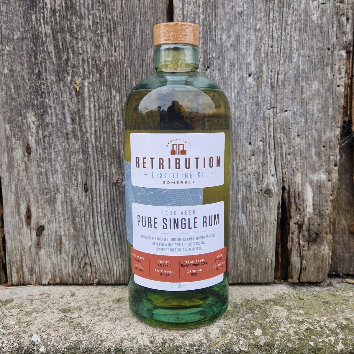 Single cask aged rum bottle with green glass and cork, front label visible