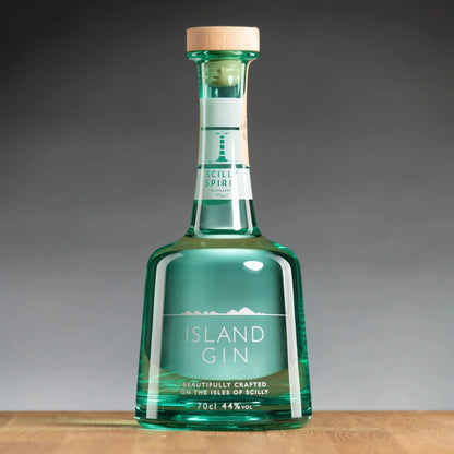 Island gin bottle with teal glass, cork stopper, and “ISLAND GIN” front label