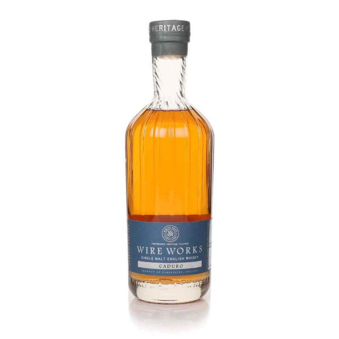 Single malt whisky bottle with black foil neck, amber liquid, and Caduro label