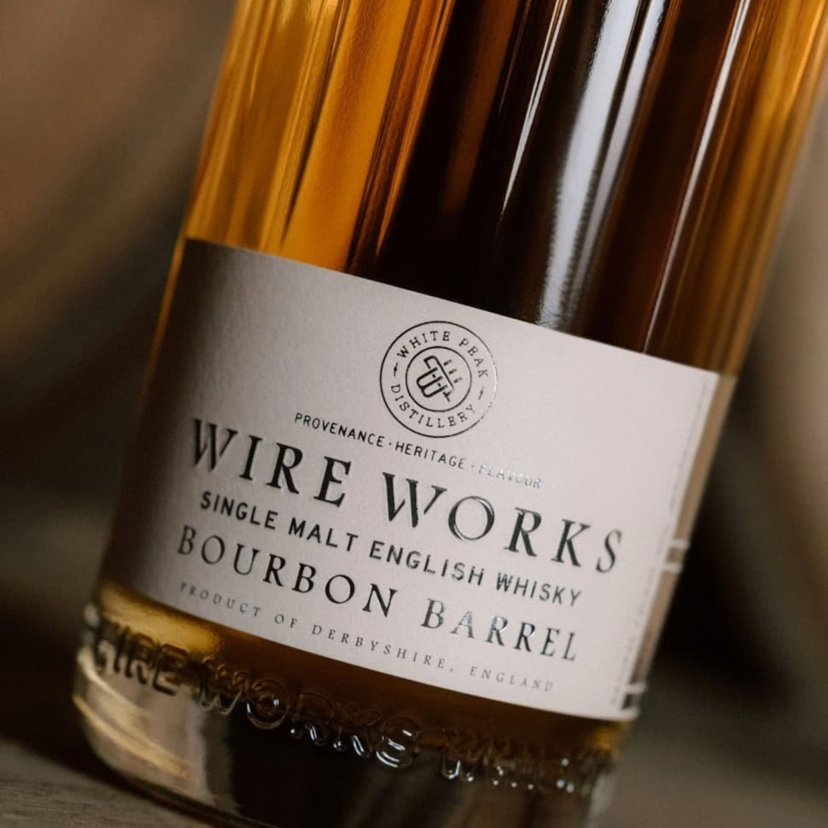 Bourbon barrel whisky bottle label close-up on amber glass